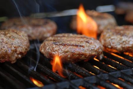 photo of hamburger patties being grilled