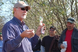Walt Bentley speaks to growers at a field day.