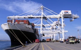 A cargo ship is loaded at the Port of Oakland.