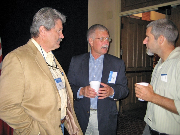 CASI executive board member Ron Harben (left), UC Cooperative Extension cropping systems specialist Jeff Mitchell (center) speak with Paul Hicks of Catholic Relief Services during a break at the Water for Food Conference.