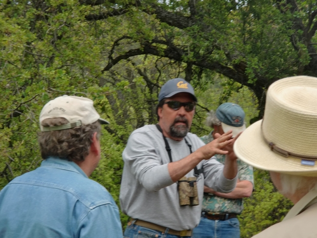 Greg Giusti, UCCE forester and wildlife biologist, speaking with landowners and managers on the field trip.