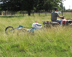 The rotary wiper can be pulled through the field with an ATV.