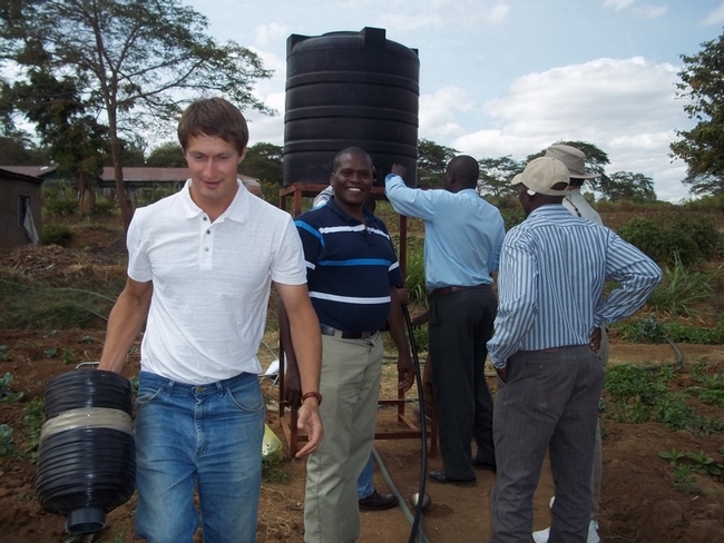 Oleg Daugovish demonstrating gravity-flow drip line irrigation system in Kenya.