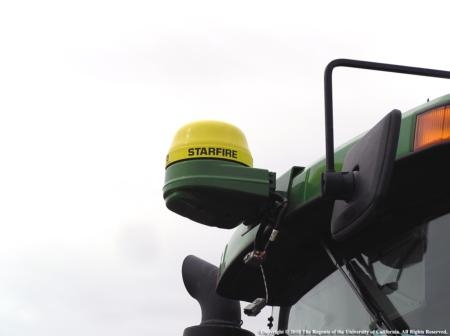 GPS receiver mounted on a tractor cab. GPS systems are increasingly used in agriculture. Photo J. Williams.